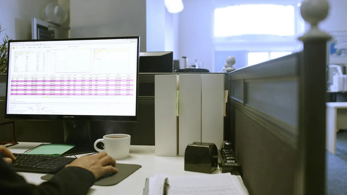 Dispatcher pricing a shipment at a desk